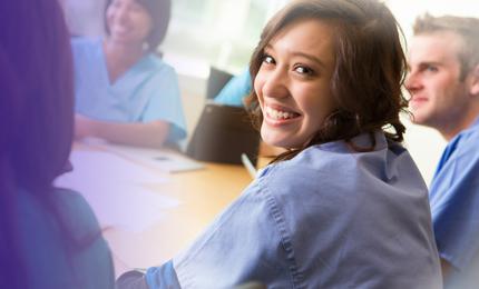 Female medical student in lab coat